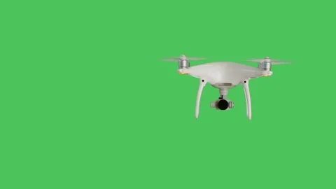 Drone with a Camera Flying. Background is Green Screen. Stock Footage