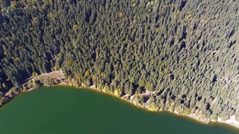 Drone camera flying over the  clean volcanic lake called Saint Anna Stock Footage 162117264