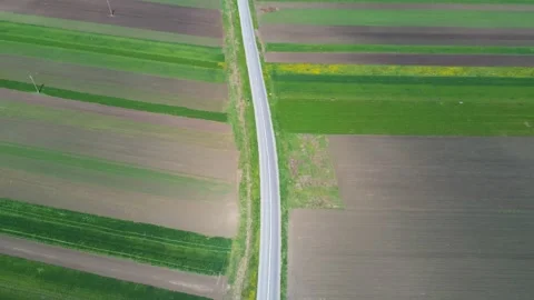 Drone camera flying over an empty asphalt road Stock Footage 153803742