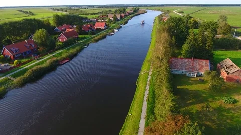 Drone camera flying over the river on a countryside on a sunny summer day - 14 Stock Footage 74867425