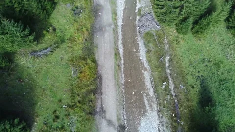 Drone camera flying over  a small clean creek in the woodlands Stock Footage 140394977