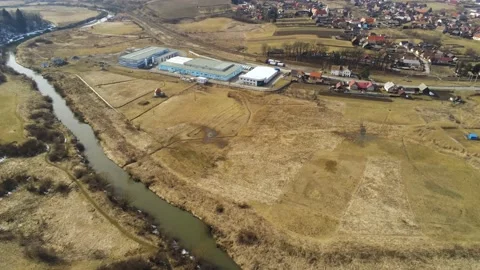 Drone camera flying over a small factory Stock Footage 150320584