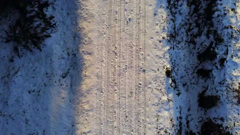 Drone camera flying over snowy road f Stock Footage 149601651