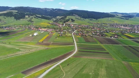 Drone camera flying towards a hungarian village in Transylvania Stock Footage 153803734