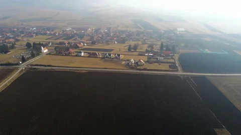 Drone camera flying towards a small village Stock Footage 149357306