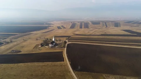 Drone camera flying towards a small catholic church Stock Footage 149357327