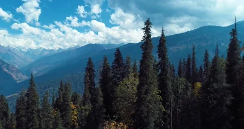 Drone camera flying from tree to mountain and forest. blue sky with cloud Stock Footage 159042175