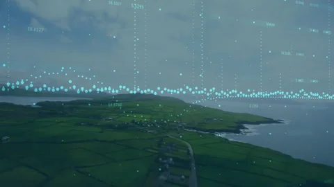 Drone camera gliding over fields as turquoise waveform pulsing and columns Video stock 311698041