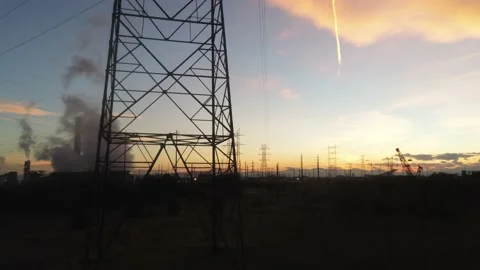 Drone camera goes from person all the way up  through power tower to the sun. Stock Footage 141421132
