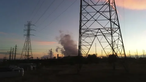 Drone Camera Goes Under Power Towers To See Sunset Stock Footage 141423240