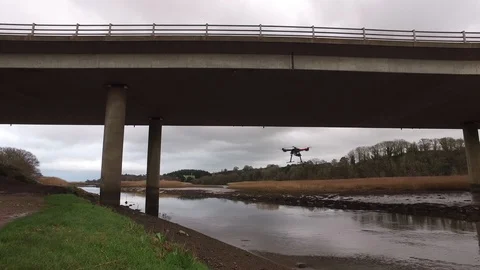 Drone Camera hovering under motorway bridge Stock Footage 95073453