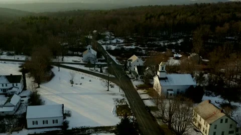 A Drone Camera Hovers And Tilts Down At Small New England Town Stock Footage 329901463
