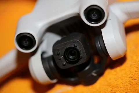 Drone with camera isolated on table close up colorful background modern aer.. Stock Photos