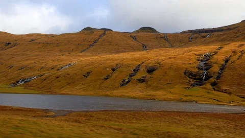 Drone camera moves across beautiful landscape with mountains waterfalls lakes Stock Footage 92641520