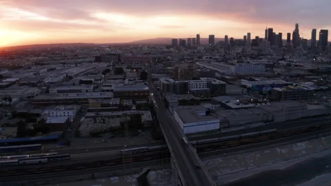 Drone camera orbits around to reveal downtown Los Angeles during sunset Stock Footage 145094391