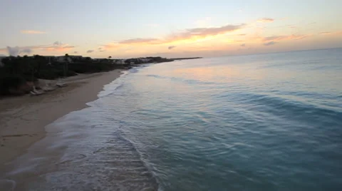 Drone Camera Races down Beach, Waves crashing Stock Footage 39589235