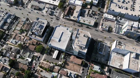 Drone camera rises above roofs of the city in Los Angeles, California, USA Stock Footage 158387307