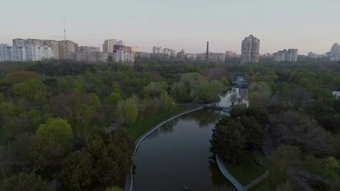 Drone camera rises over the lake in Victory Park, Odessa Ukraine Stock Footage 74912480