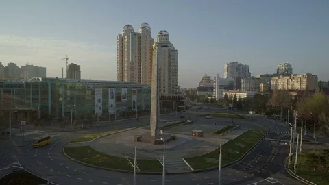Drone camera rises towards the memorial in 10th April Square, Stock Footage 74912873