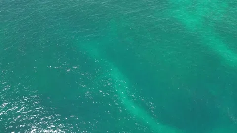 Drone camera rises view from the sea to the reef Stock Footage 240182381