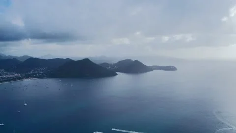 Drone camera shoots the hilly coast with the city (Rodney Bay, Saint Lucia) Video stock 132001487