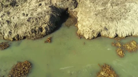 Drone camera slowly landing in front of a steel pipe Stock Footage 149927502