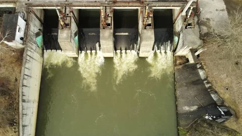 Drone camera slowly landing ,in front of  a small dam over Olt river Stock Footage 150320581