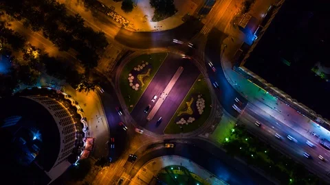 Drone camera spin around crossroads night city. Nightlife road with yellow light Stock Footage 114017794