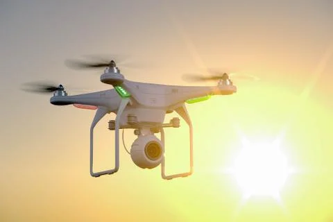 Drone with camera on sunset background Illustrazione stock