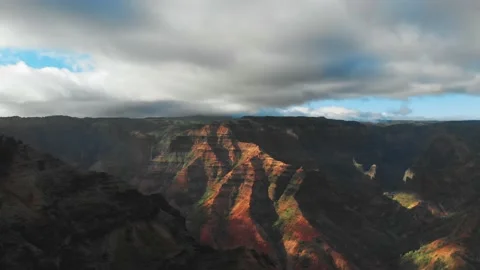 Drone camera takes off under the cloudy sky touching the peaks of the mountains Video stock 138238034