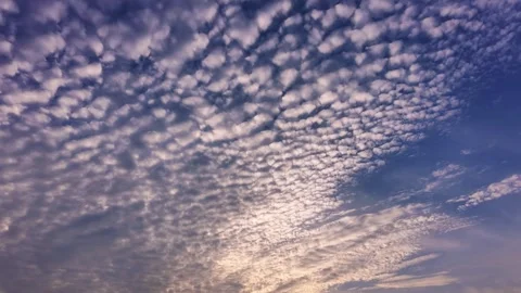 Drone Camera Tilting Up From Hazy Rural Horizon to Dragon Scale Clouds Stock Footage 344838008