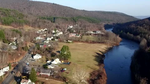A Drone Camera Tilts Down At A Riverside Village in Western Massachusetts Stock Footage 329901570