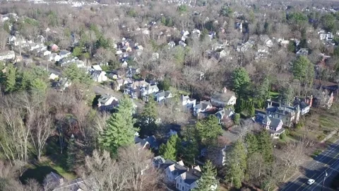 A Drone Camera Tilts Up To Reveal A Northampton Neighorhood Stock Footage 329773751