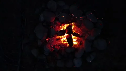 Drone camp fire blue hour night scene Stock Footage 247643891