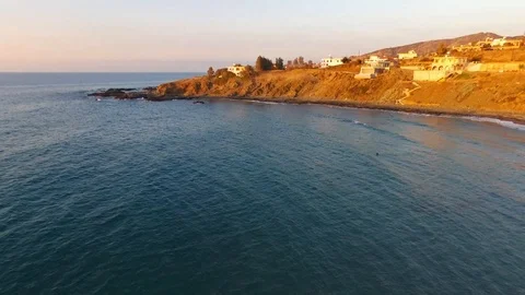 Drone capture of beautiful rocky beach at sunset in Pomos, Cyprus Stock Footage 105478138