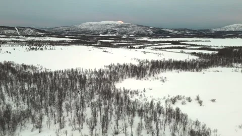 Drone captured aerial view featuring the stunning winter scenery of Norway, Stock Footage 330376564