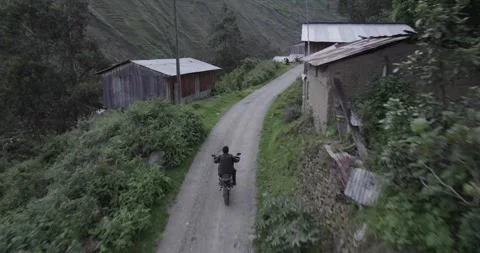 Drone-Captured Dirt Road Motorcycle Adventure by the River Stock Footage 280092880