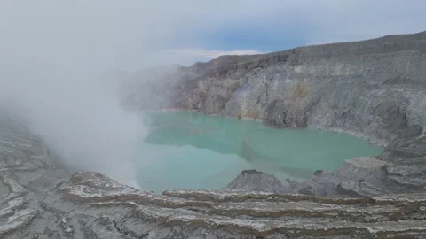 Drone captured video of the Ijen volcano in East Java, Indonesia, featuring its Vídeos de archivo 330376881