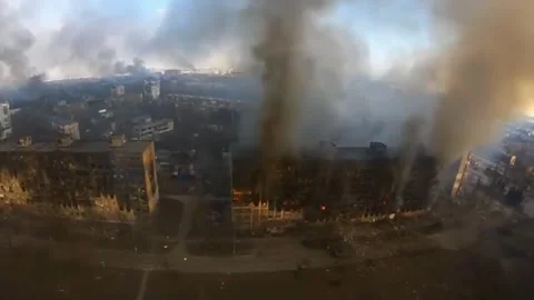 Drone Captures Artillery Hit Causing Fire and Destruction in Ruined City Stock Footage 324713110