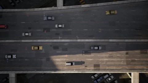 The drone captures busy traffic on a multi-lane highway and flies with the flow Stock Footage 257338949