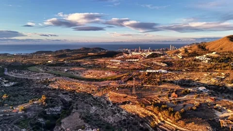 Drone captures coastal hills at sunset. Panoramic aerial image of shoreline Stock Footage 342360819