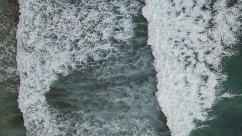 Drone captures crashing waves and foam at Sawangan beach Stockbeeldmateriaal 237467711