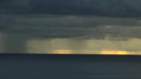 A drone captures dark clouds gathering over the ocean. Stock Footage 307775088