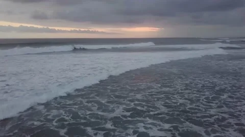 The drone captures the dark coast and the sea under the dark sky. Stock Footage 155972247