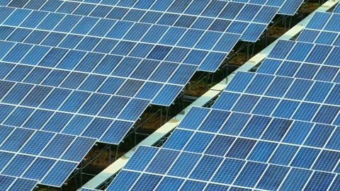 The drone captures an expansive field of solar panels. Stock Footage 306140131