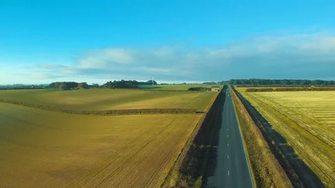 A drone captures fields and a road in East Yorkshire Stock Footage 97188304