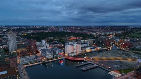 Drone captures Malmö’s maritime skyline in tranquil summer hues Stock Footage 340212740