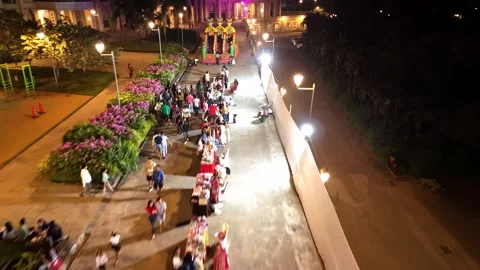 Drone Captures Night Fun Around Colorful Bounce House Stock Footage 311623885