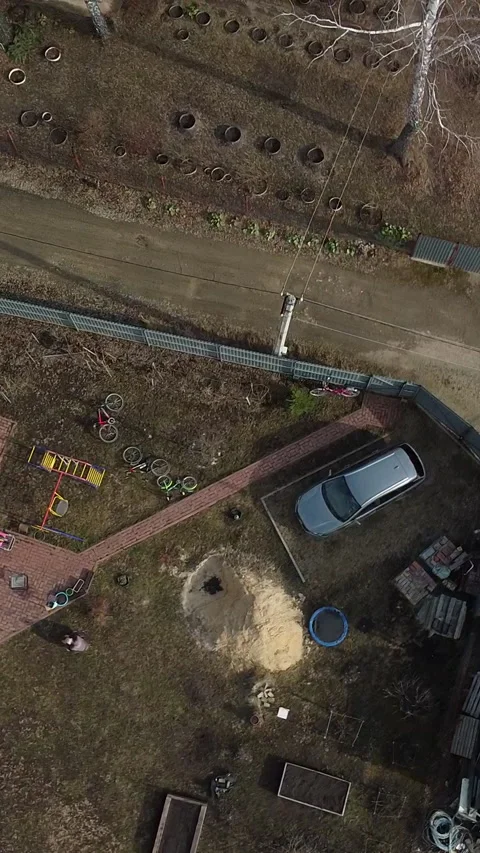 Drone captures a quiet, leafless backyard in early spring Video stock 347498922