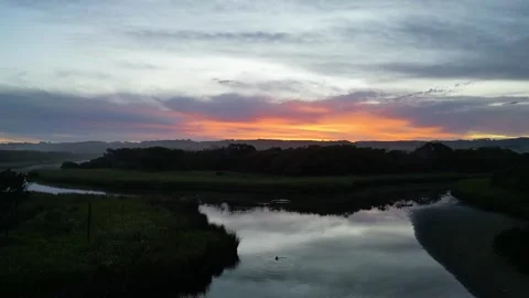 Drone captures a red sunset over a calm river in Apollo Bay, Australia. Stock Footage 326972947